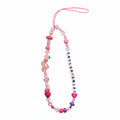 Colorful beaded "Taylor Swift" phone charm with green gummy bear charm – product view