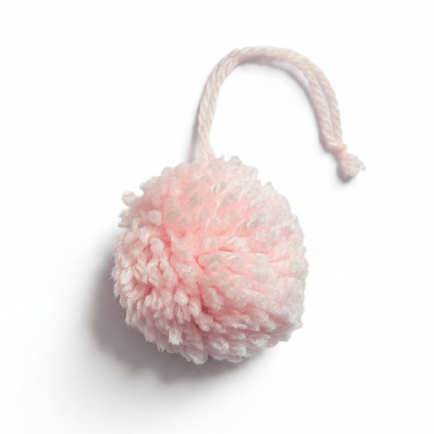 Light pink cotton and polyacrylic yarn pom pom charm – product view