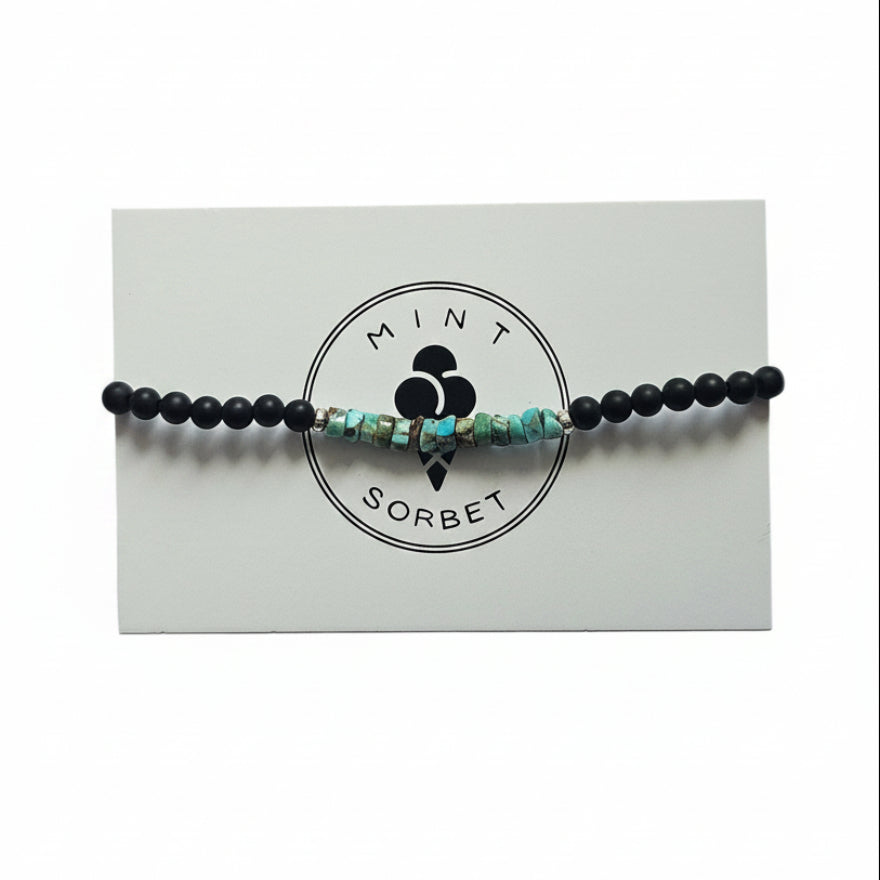 Black onyx and turquoise amazonite beaded bracelet with silver accent bead on Mint Sorbet packaging card