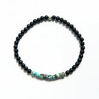 Black onyx and turquoise amazonite beaded bracelet with silver accent bead – product view