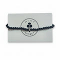 Black lava stone and black tourmaline beaded bracelet with silver accent beads on Mint Sorbet packaging card