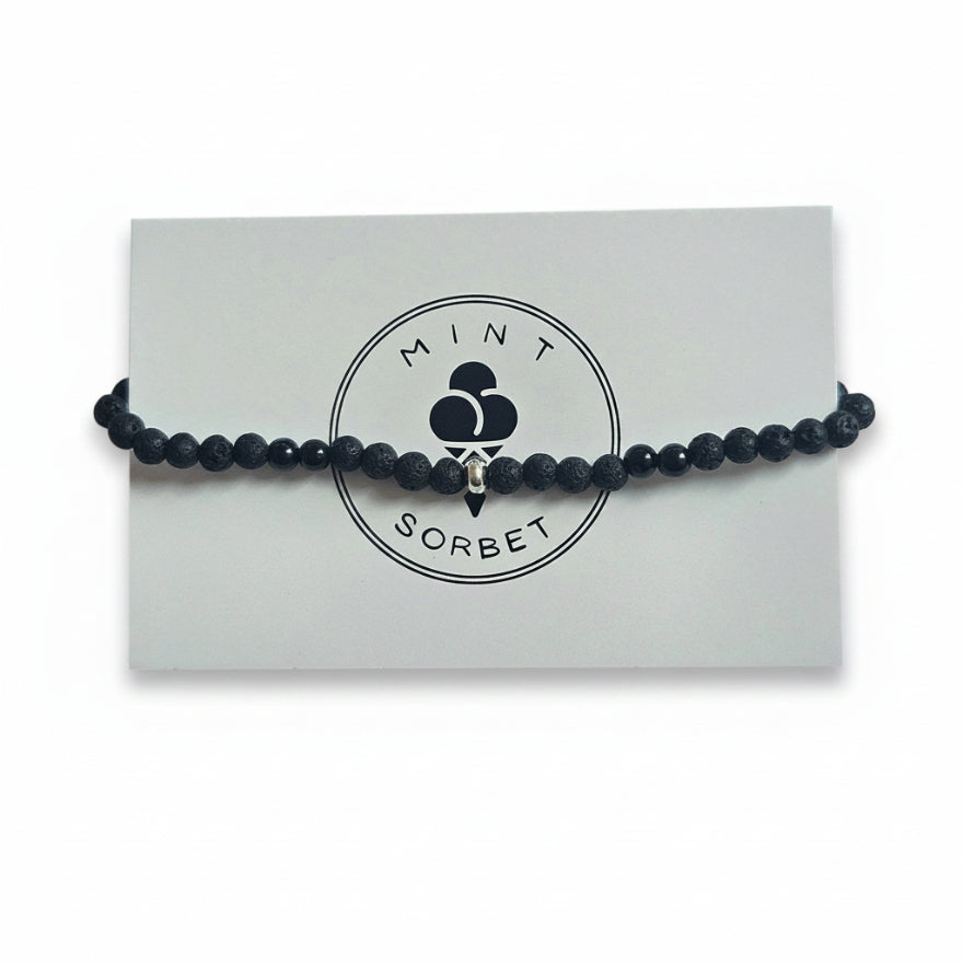 Black lava stone and black tourmaline beaded bracelet with silver accent beads on Mint Sorbet packaging card
