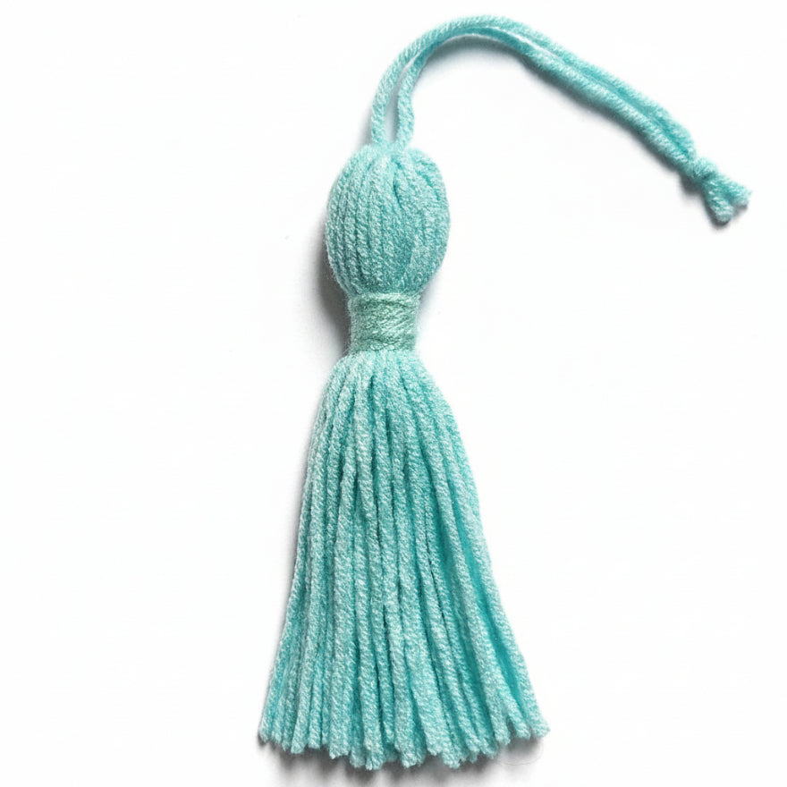 Light blue cotton and nylon tassel charm – product view