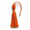 Orange cotton and nylon tassel charm – product view