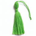Green cotton and nylon tassel charm – product view