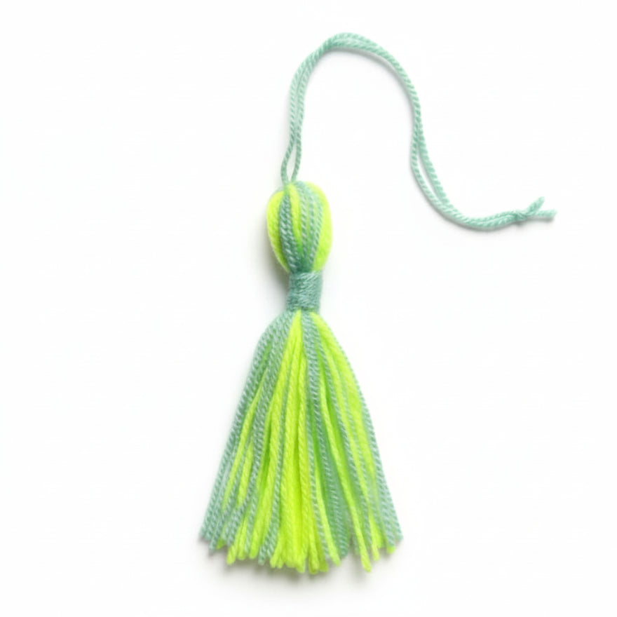 Neon yellow and mint green cotton and nylon tassel charm – product view